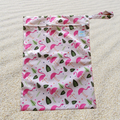 Flamingo Waterproof Wet Bag: Brighten up your day with our playful flamingo waterproof wet bag! Designed to keep wet items contained, this bag is perfect for swim gear, messy clothes, or cloth diapers. Made from durable, eco-friendly materials, it features a fun flamingo print that adds a splash of color to your essentials. Lightweight and reusable, it's a practical solution for parents on the go.