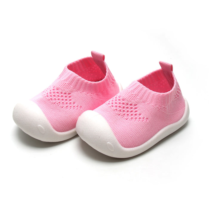 Pink slip-on shoes for kids with flexible design, ideal for natural foot development.