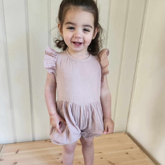 Breathable organic muslin cotton overalls with practical button closure for kids