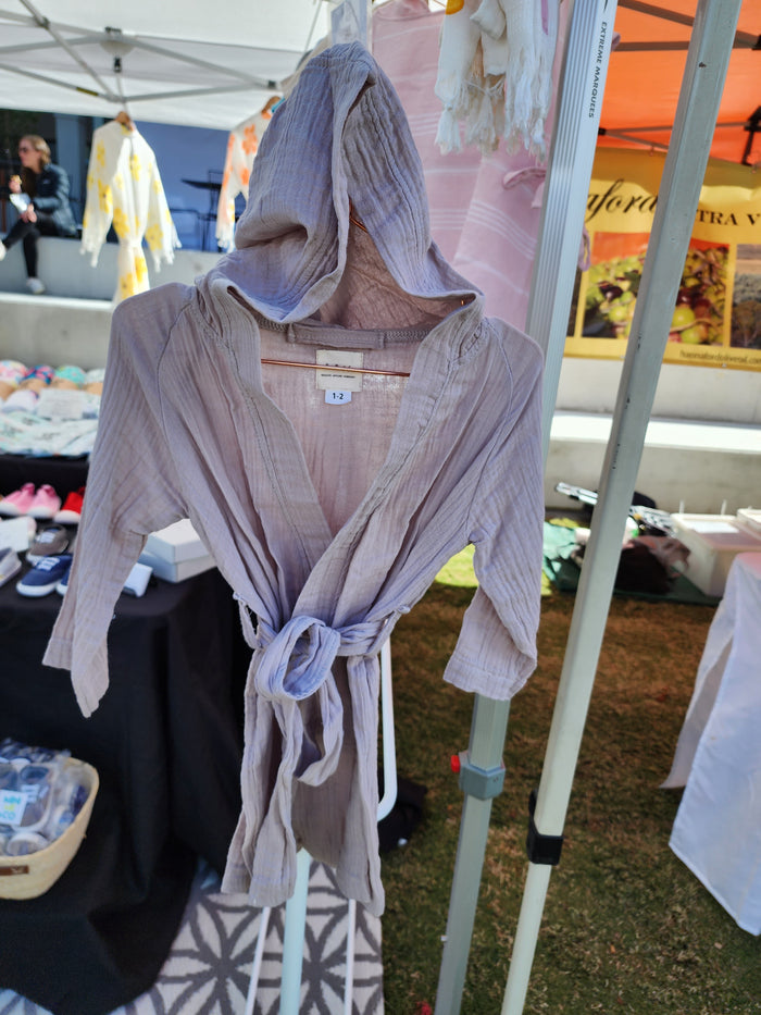 Beige kids robe made from organic Turkish cotton for softness and absorbency.