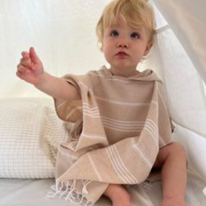 Kids poncho towel with convenient side ties for adjustable fit, designed for ages 1-4 and 5-8 years.