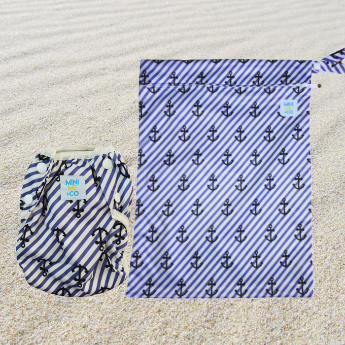 Mini Me & Co anchor set with reusable swim nappy and matching waterproof wet bag, featuring a nautical anchor design, adjustable fit, and leak-proof protection for babies and toddlers.
